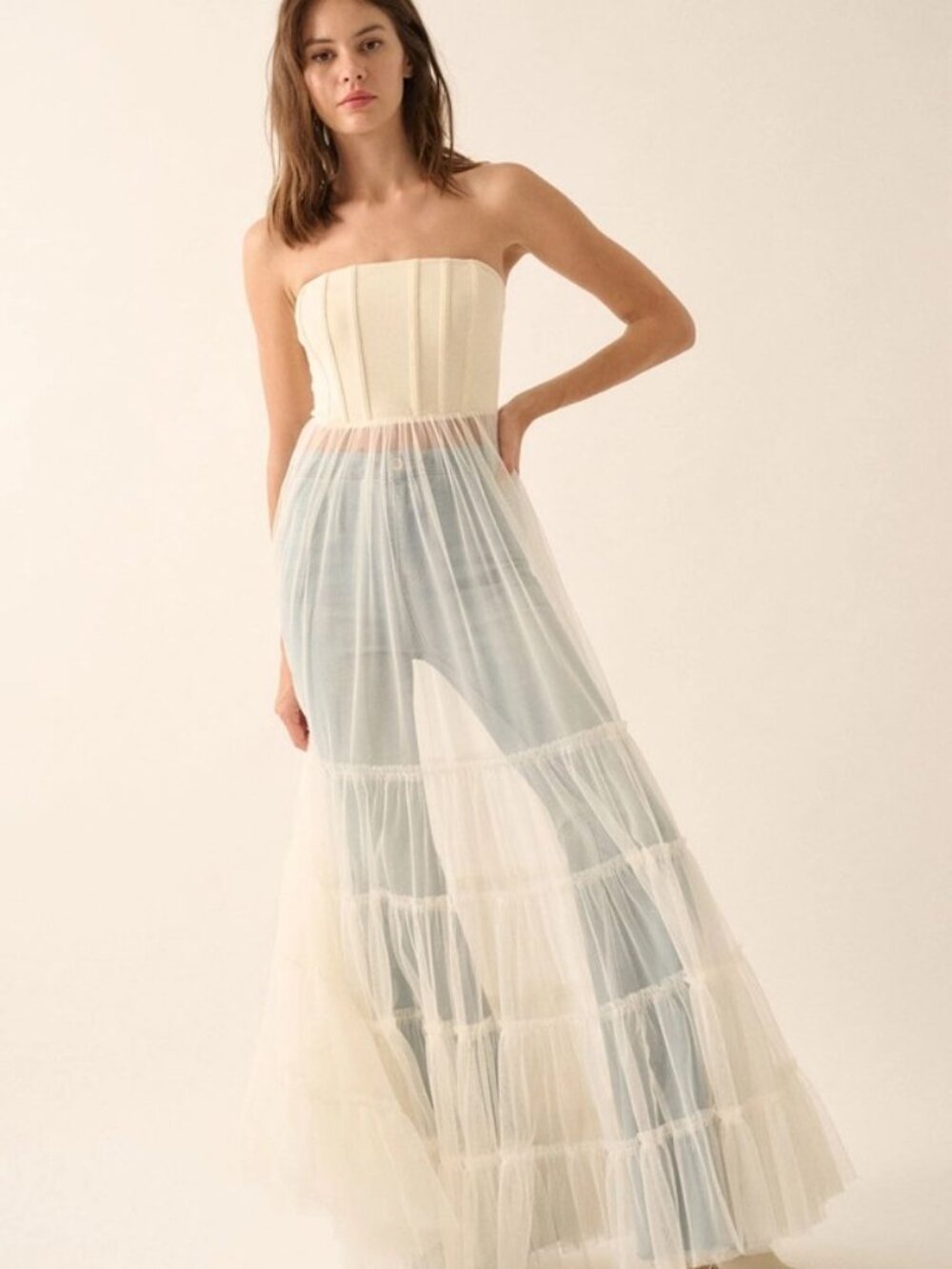A sheer tulle maxi dress with corset-style bodice